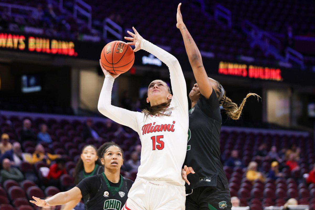 Cleveland, OH - RedHawks junior forward Amber Tretter (15) shoots a Bobcat contested layup during the women's MAC Basketball Tournament at Rocket Arena in Cleveland, Ohio.