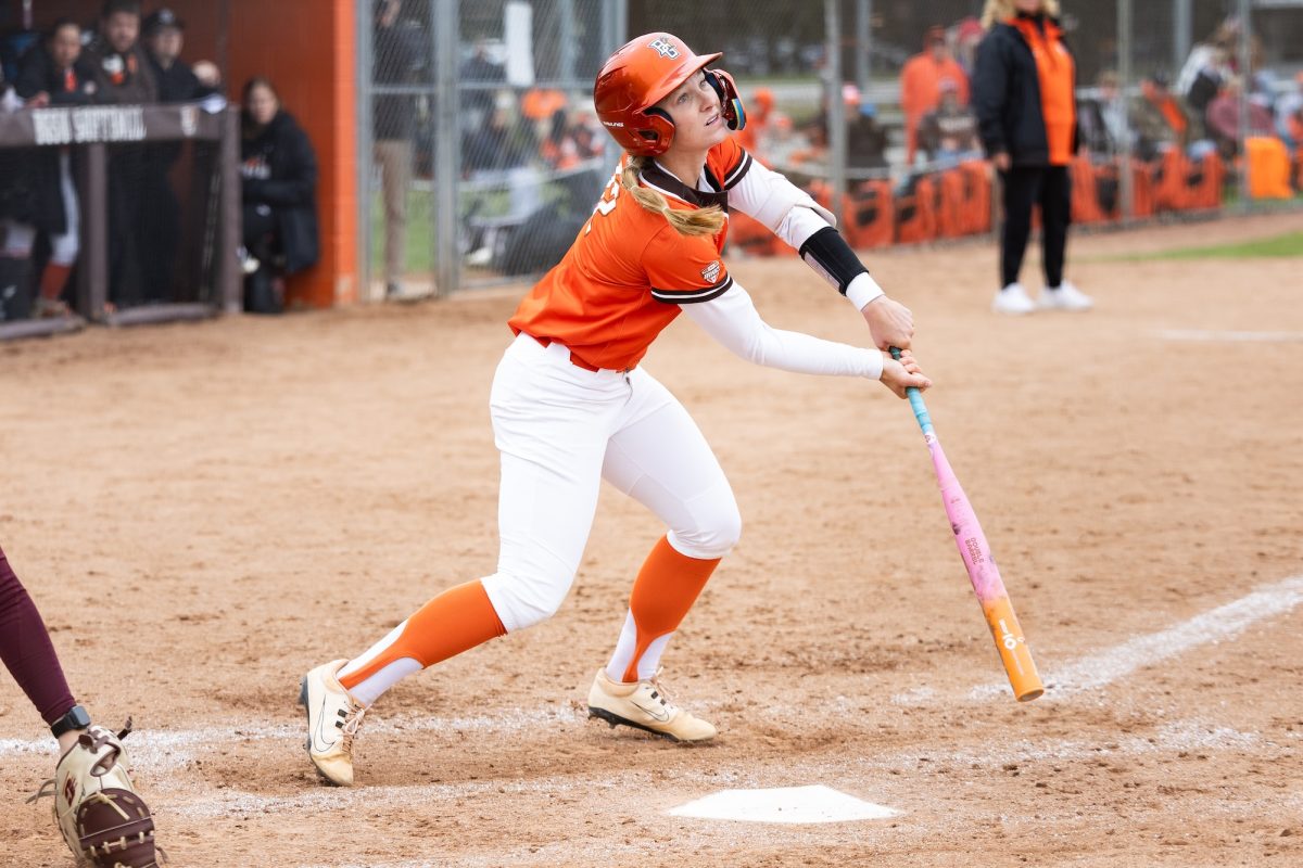 Bowling Green, OH - Falcons junior shortstop Cameron Kaufman (12) looks towards the fence after hitting a pop-up during a game between the Central Michigan Chippewas and the Bowling Green Falcons at Meserve Field in Bowling Green, Ohio.