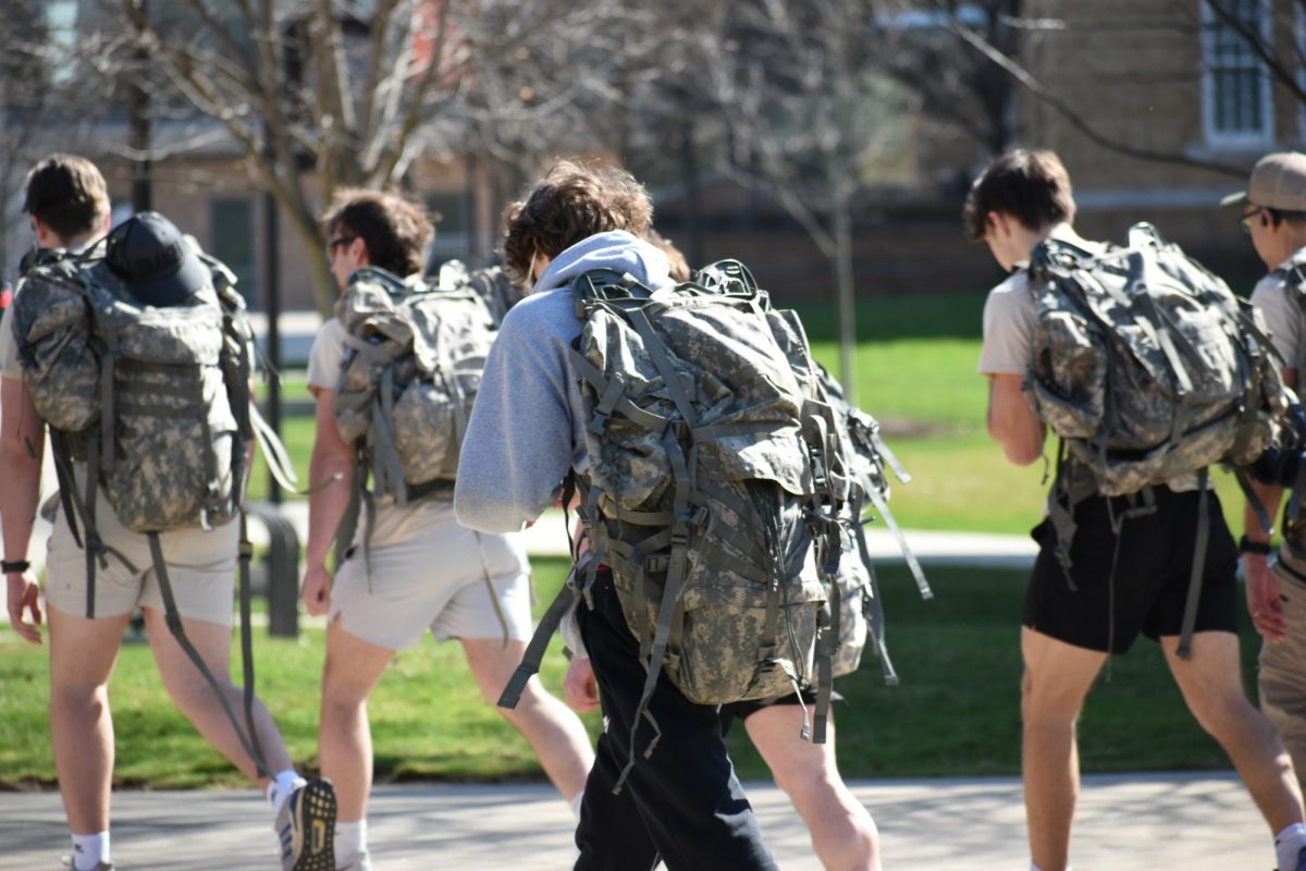 Bowling Green, OH - Walkers trek between the Bowen-Thompson Student Union and the BGSU letters during the Walk a Mile in a Soldier’s Shoes event.