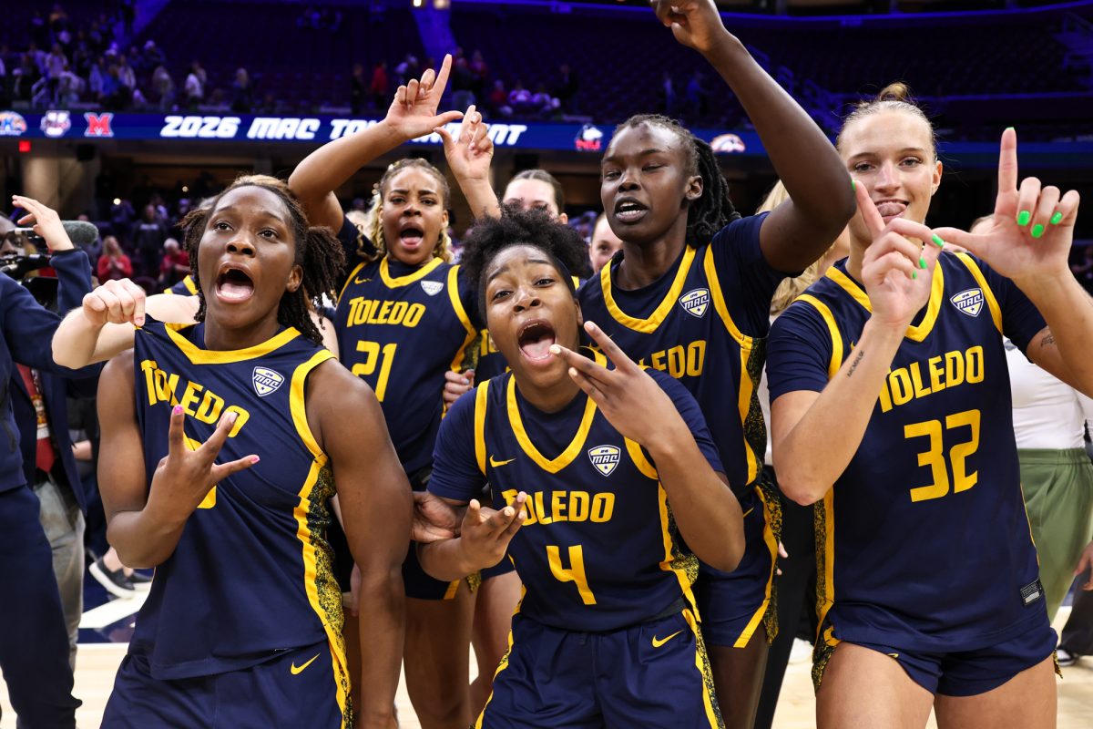 Cleveland, OH - The Toledo Rockets celebrate defeating the Ball State Cardinals during the semifinal round of the women's MAC Basketball Tournament at Rocket Arena in Cleveland, Ohio.