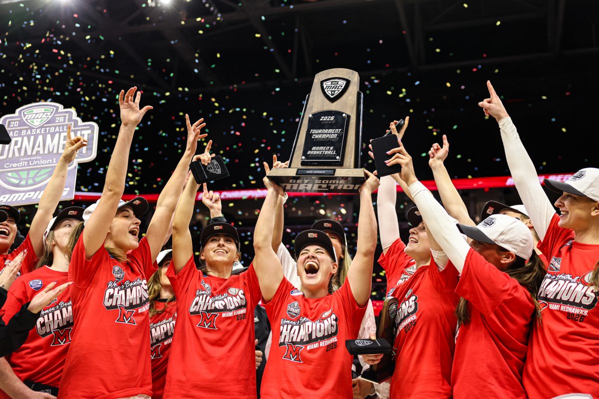 Cleveland, OH - The Miami RedHawks celebrate after defeating the Toledo Rockets in the MAC Championship game at Rocket Arena in Cleveland, Ohio.