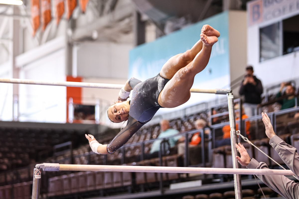 Bowling Green, OH - Falcons freshman Addie Tandeski transfers between bars at the Stroh Center in Bowling Green, Ohio.