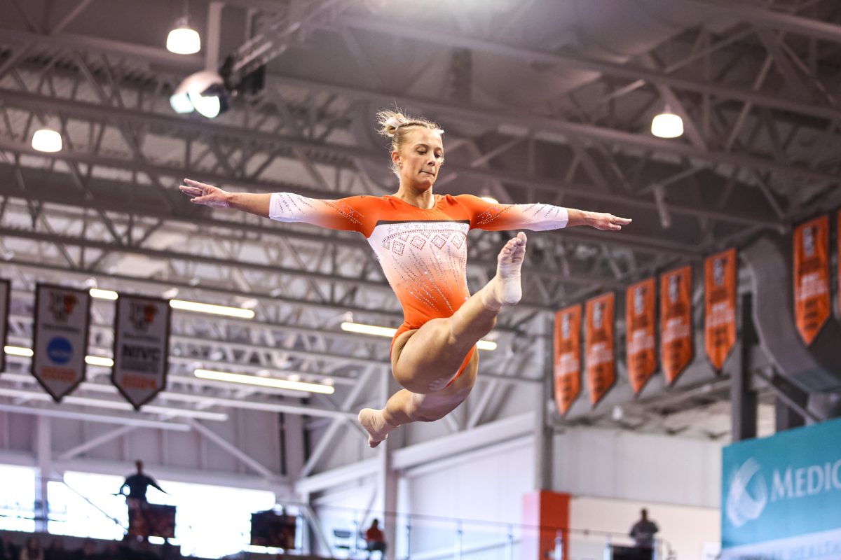 Bowling Green, OH - Falcons senior Madison Coburn performs on the beam at the Stroh Center in Bowling Green, Ohio.