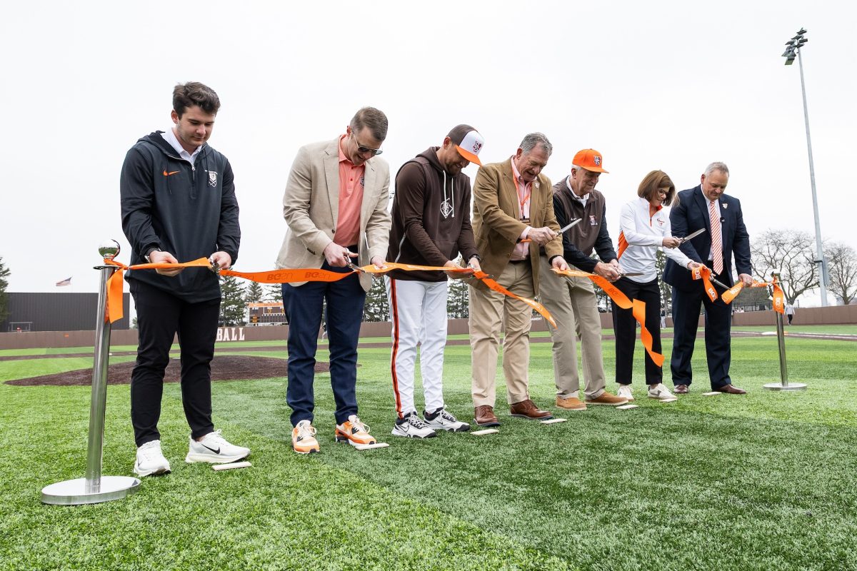 Bowling Green, OH - Members of the BGSU baseball community cut the ribbon during a game between the Ohio Bobcats and the Bowling Green Falcons at Steller Field, in Bowling Green, Ohio.