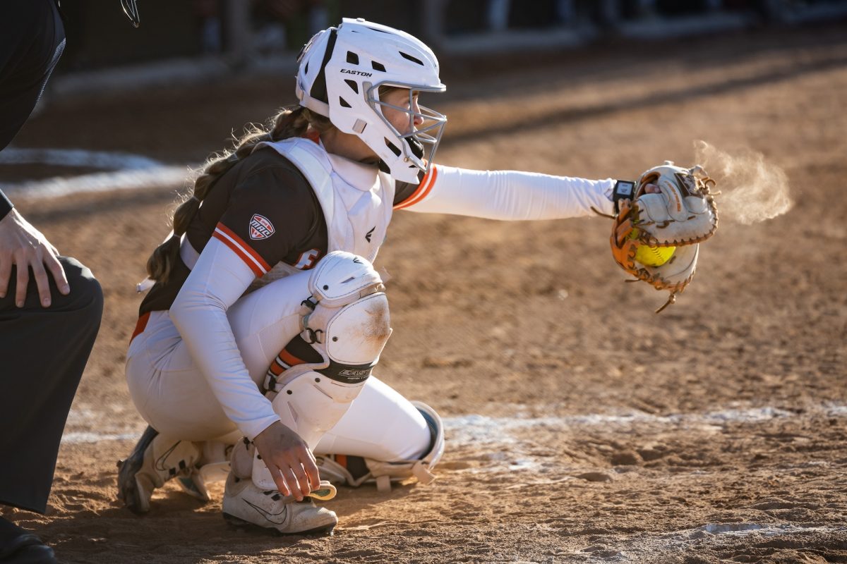 Bowling Green, OH - Falcons senior catcher Ashley Chevalier (14) catches a pitch during a game between the Buffalo Bulls and the Bowling Green Falcons at Meserve Field in Bowling Green, Ohio.