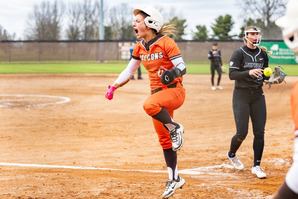 Bowling Green, OH - Falcons redshirt sophomore third baseman  Addie Martin (0) gets up screaming after a creative slide to score during a game between the Buffalo Bulls and the Bowling Green Falcons at Meserve Field in Bowling Green, Ohio.