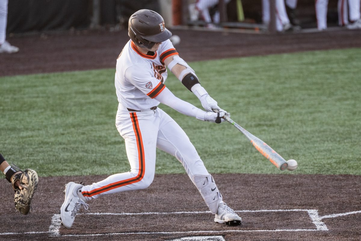 Bowling Green, OH - Falcons junior infielder Vinny Salvione (23) hits a ball off the end of the bat during a game between the Findlay Oilers and the Bowling Green Falcons at Stellar Field in Bowling Green, Ohio.