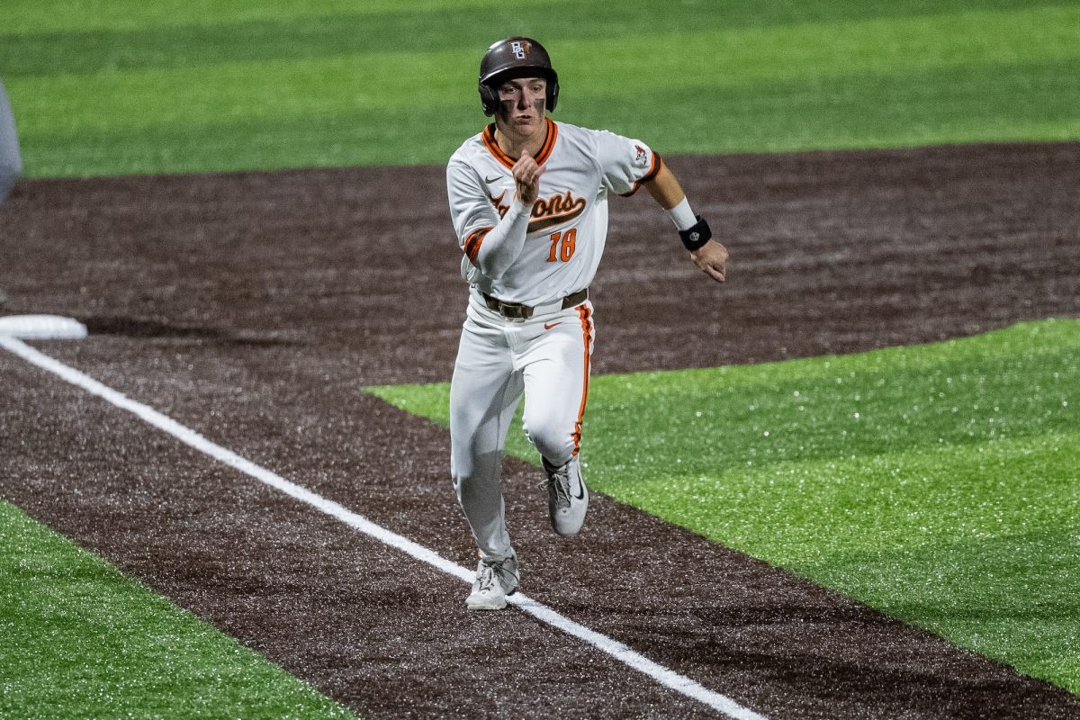 Bowling Green, OH - Falcons freshman infielder Griffin Scheiderer (18) sprints up the third-base line to score a run during a game between the Findlay Oilers and the Bowling Green Falcons at Stellar Field in Bowling Green, Ohio.
