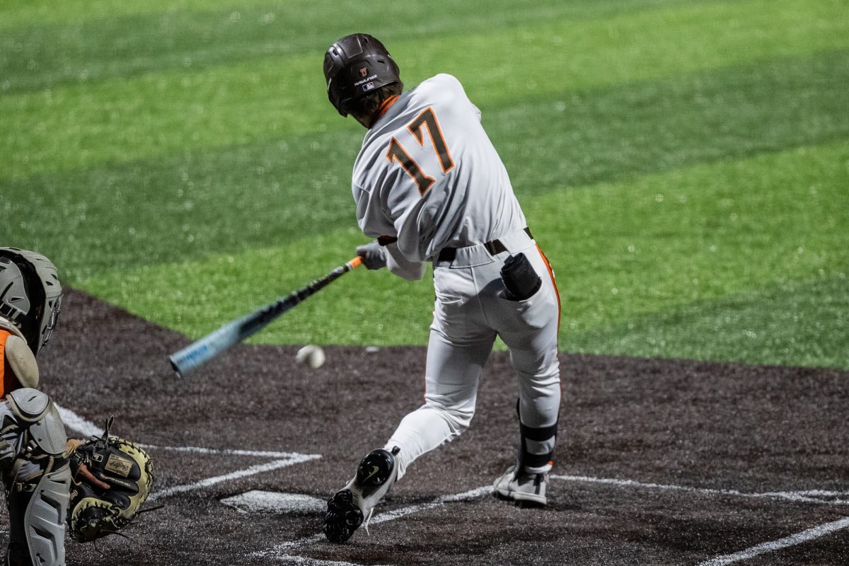 Bowling Green, OH - Falcons sophomore outfielder Carter Mottice (17) puts a ball in play during a game between the Findlay Oilers and the Bowling Green Falcons at Stellar Field in Bowling Green, Ohio.