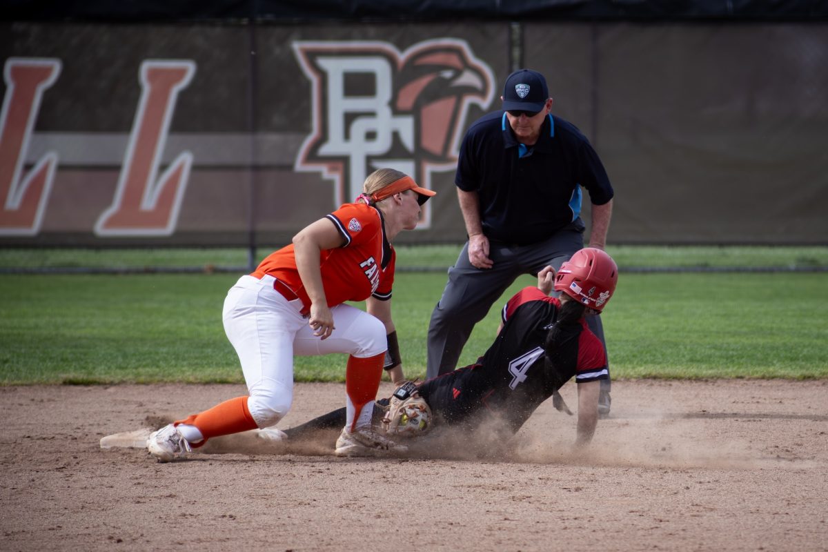 Bowling Green, OH - Falcons senior shortstop Hannah Hunt (2) tagging the runner out at second during a duel between the Bowling Green Falcons and the Northern Illinois Huskies at Meserve Field in Bowling Green, Ohio.