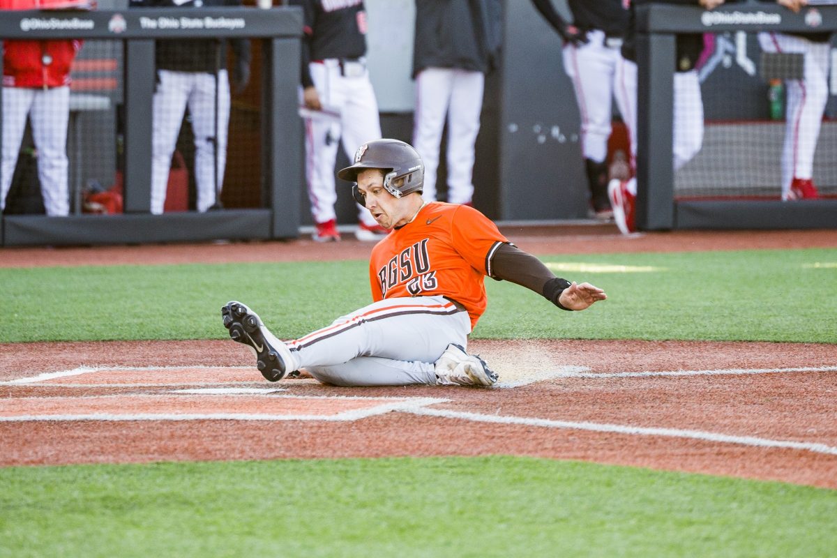 Columbus, OH - Falcons junior infielder Vinny Salvione (23) slides into home at Bill Davis Stadium in Columbus, Ohio.