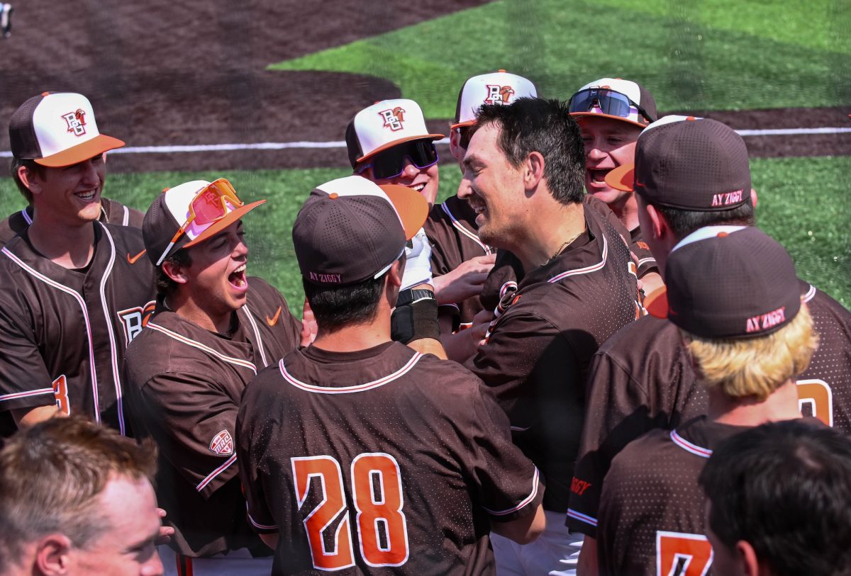 Bowling Green, OH - Falcons baseball team celebrating with redshirt senior Zack Horky (34) after his home run hit at Steller Field in Bowling Green, Ohio.