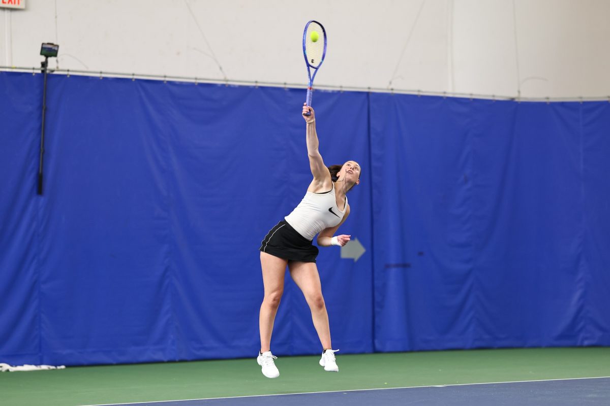 Perrysburg, OH - Falcons junior Tia Clemens serves the ball to the Buffalo Bulls at the Perrysburg Tennis Center in Perrysburg, Ohio.
