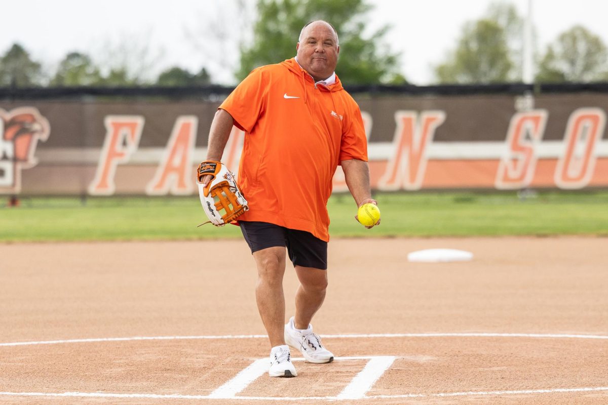 Bowling Green, OH - Steve Messinger, Associate AD for Operations, Events and Championships, throws out the first pitch honoring his retirement before a game between the Massachusetts Minutewomen and the Bowling Green Falcons at Meserve Field in Bowling Green, Ohio. 