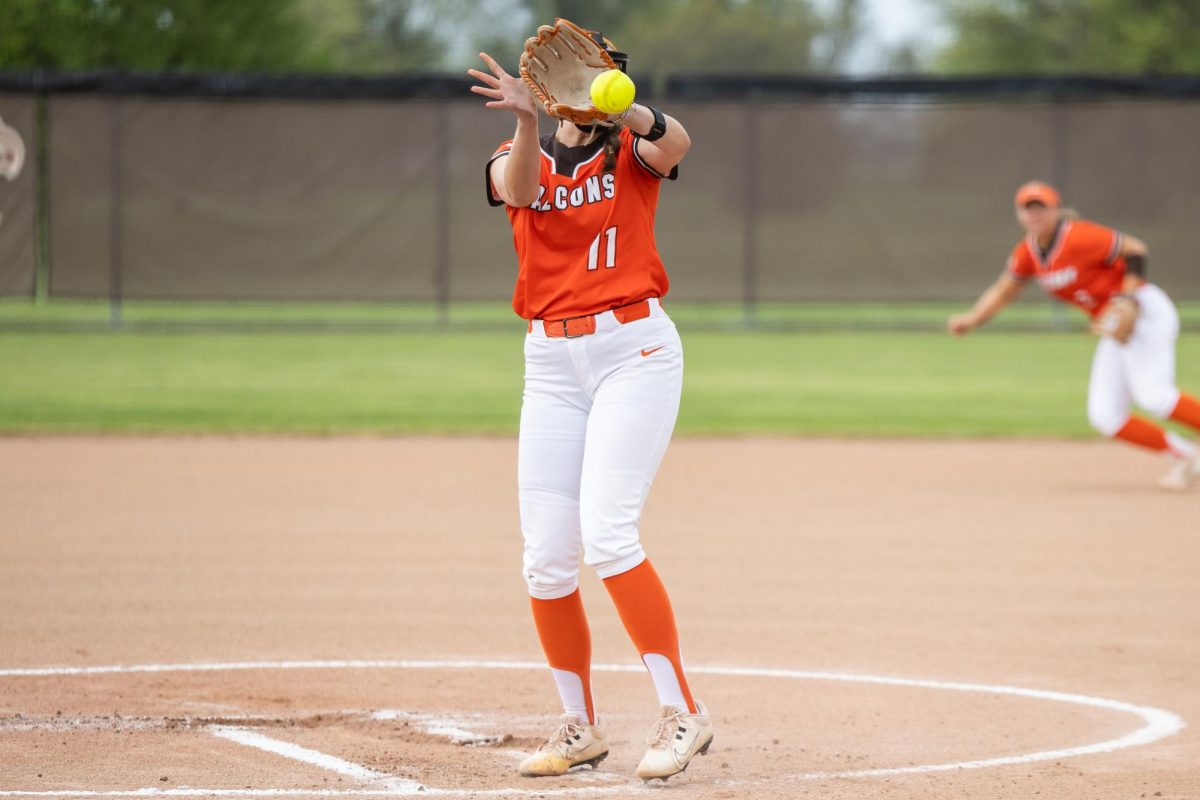 Bowling Green, OH - Falcons senior pitcher Mackenzie Krafcik (11) catches a come-backer during a game between the Massachusetts Minutewomen and the Bowling Green Falcons at Meserve Field in Bowling Green, Ohio. 