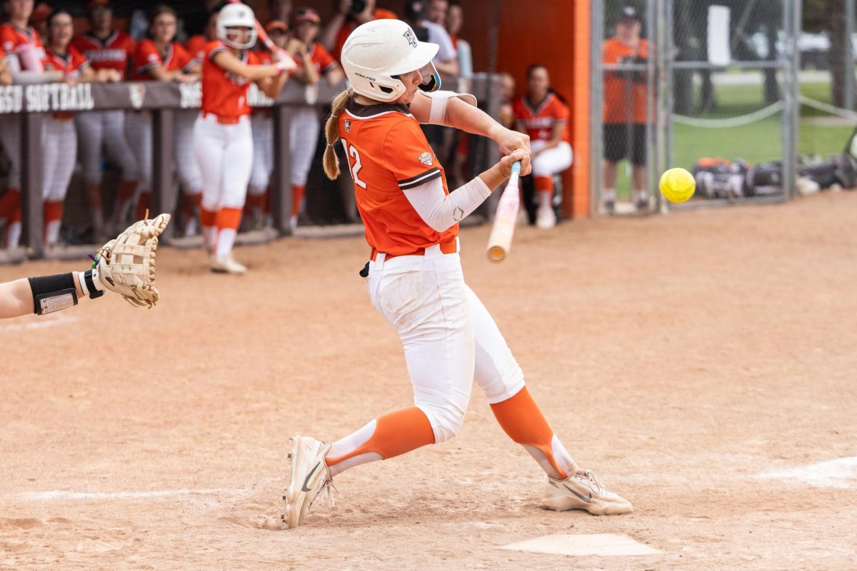 Bowling Green, OH - Falcons junior shortstop Cameron Kaufman (12) hits a line drive during a game between the Massachusetts Minutewomen and the Bowling Green Falcons at Meserve Field in Bowling Green, Ohio. 
