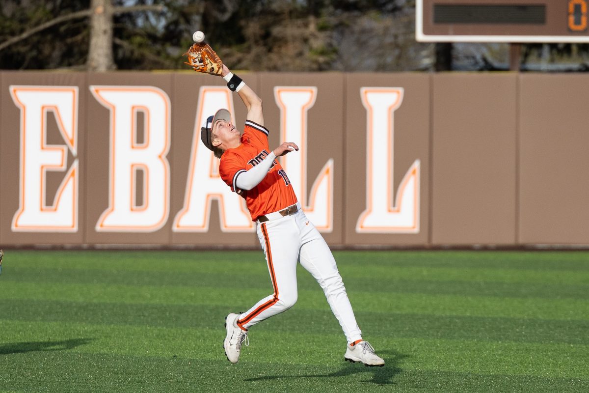 Bowling Green, OH - Falcons freshman infielder Griffin Scheiderer (18) runs back to catch a fly-ball at Steller Field, in Bowling Green, Ohio.