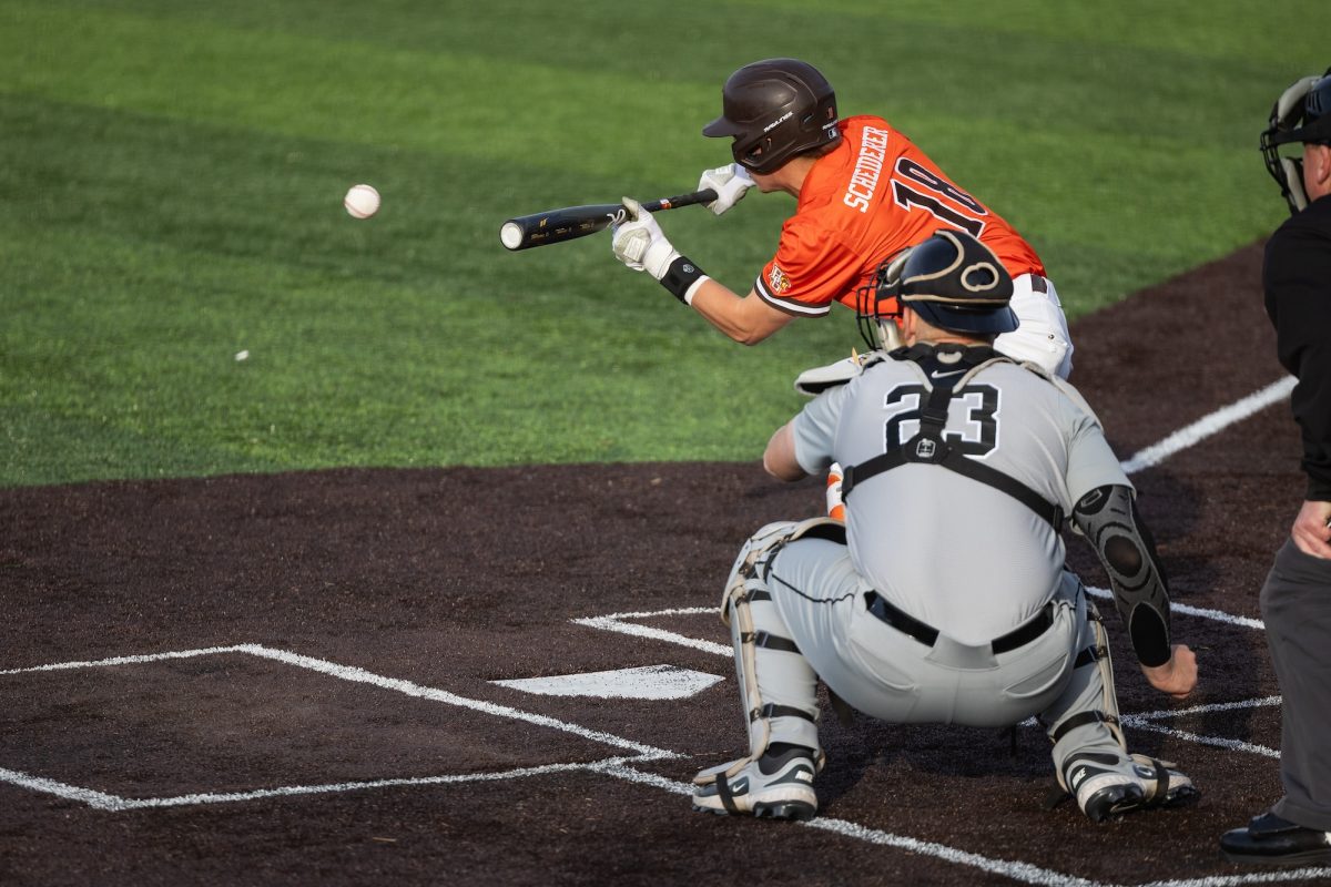 Bowling Green, OH - Falcons freshman infielder Griffin Scheiderer (18) lays a bunt down at Steller Field, in Bowling Green, Ohio.