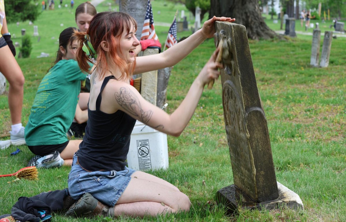 Ahmed Aly's photo of Students from the Andrew Jackson Davison (AJD) Club participating in a “Cemetery Blitz”
at the historic West State Street Cemetery in Athens, Ohio won the Heritage Ohio Preservation Month Photo Contest. 